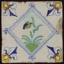 Tile, flower on ground in brown, yellow, green and blue on white, inside serrated square with plume, corner pattern French lily