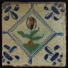 Tile, tulip on ground in orange, purple and blue on white, inside serrated squared with tuft, corner pattern french lily, wall