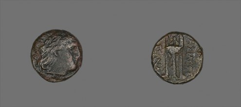 Coin Depicting the God Apollo, 316/297 BC, issued by Cassander, Greek, Greece, Bronze, Diam. 1.8
