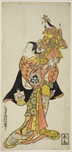 The Actor Yamashita Kinsaku holding a puppet of the Empress in the play Diary Kept on a Journey by