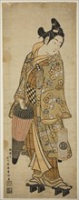 The Actor Sanogawa Ichimatsu I as a young man holding an umbrella and a lantern, c. 1748, Ishikawa