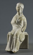 Statuette of a Seated Woman, 400/350 BC, Greek, Greece, terracotta, 18.1 × 6.4 × 7.6 cm (7 1/8 × 2