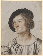 Portrait of a young man, 1517, silver pen, on light gray primed paper, with red chalk and brush in