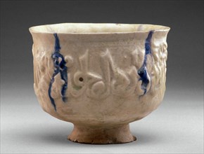 Islamic, Iranian, Molded Bowl, late 12th - early 13th century, composite body, lead glaze with