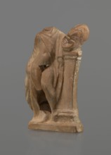 Terracotta figurine of a youth with a terracotta mask, ca. 332–30 BC; Hellenistic period 4th