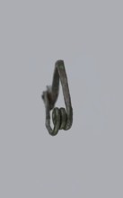 Arched fibula. Fibula with an arched bow; the pin emerges from a double-coiled spring. The sheath