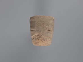 Pyramidal clay seal with a roughly square stamp surface and rounded corners. Shallow incisions at