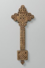 Hand cross, Ethiopian workshop. The arms of the cross are each formed by three stacked discs