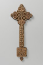 Hand cross, Ethiopian workshop. The arms of the cross are each formed by three stacked discs