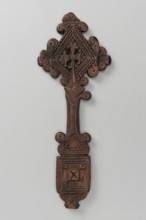 Hand cross. The arms of the cross are rhombus-shaped, the tops decorated with volutes topped with