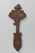 Hand cross, Ethiopian workshop. The arms of the cross are rhombus-shaped, the tops decorated with