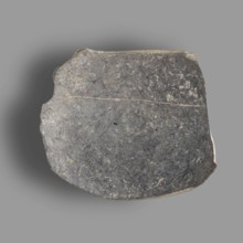 Fragment of a bucchero nero bowl with a flat bowl and a ring-shaped stem. On the inside of the bowl