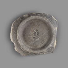 Fragment of a bucchero nero bowl. Bucchero nero; ancient Etruscan vessel, 6th–5th century BC