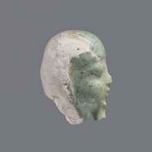 Fragment of a shabti. Head of a shabti figurine with rather carelessly rendered facial features, in