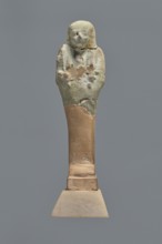 Fragment of a shabti, Mummy-shaped funerary figurine shabti, grave good, upper part preserved to