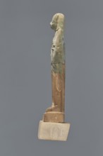 Fragment of a shabti. Mummy-shaped figurine, grave good, preserved to the beginning of the thighs.