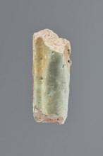 Fragment of a shabti, Middle part of the torso of a shabti figurine, preserved from the elbows to
