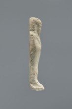 Ushabti, Mummy-shaped figurine, standing on a base with a flat back. Arms crossed on the chest,