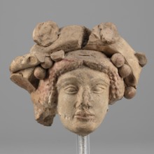 Head of Dionysus, unknown author. A small terracotta head of Dionysus, part of a larger lost