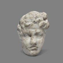 Head of a young man, unknown Greek workshop. A small head of a young man, probably a fragment of a