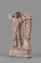Figurine of Eros with a lyre, Eros myth, Greek deity, lyre musical instrument. Figurine of Eros