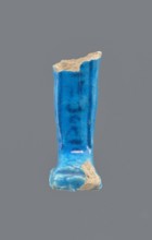 Shabti legs, Mummy-shaped figurine fragment preserved from the knees down. Feet rest on a base;
