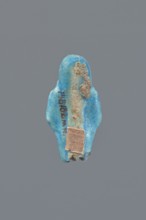 Shabti, Mummy-shaped figurine, funerary gift, supported on a pillar at the back. Legs missing. Arms