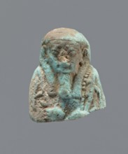 Ushabti - upper part of a figurine. Mummy-shaped funerary figurine ushabti, head and torso fragment