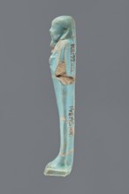 Ushabti, Mummy-shaped figurine, standing on a base with a narrow, slightly convex pillar at the