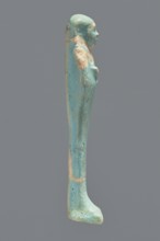 Ushabti, Mummy-shaped figurine. Standing on a base with a flat pillar at the back. Arms folded