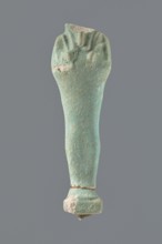Shabti, mummy-shaped figurine, standing on a base; head missing. Narrow, slightly convex pillar at