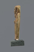 Shabti, Mummy-shaped figurine, funerary gift, standing on a base with back supported by a