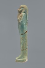 Ushabti, Mummy-shaped figurine shabti. Standing on a base with a flat pillar behind. Arms folded