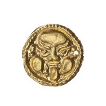 Appliqué in the shape of a Gorgon's head. Decorative appliqué for a tunic made of thin gold plate