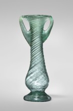 Unguentarium, unknown Eastern workshop. Glass vessel, transparent light green, Barag type VII: 1, 3