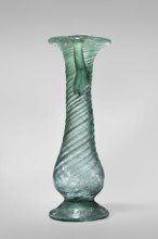 Unguentarium, unknown Eastern workshop. Glass vessel, transparent light green, Barag type VII: 1,