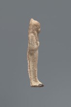 Shabti, Mummy-shaped funerary figurine, made carelessly and impressed in a mold. Hands folded on