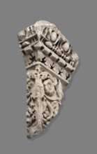 Fragment of architectural decoration. Corner section of a fragment made in relief. The cornice is