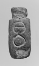 Christian amulet with Greek inscription. Limestone amulet in the shape of an elongated hexagon.