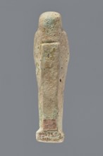 Ushabti, mummy-shaped figurine, funerary gift, hoes. Mummy-shaped figurine standing on a base, the