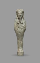 Ushabti, Mummy-shaped funerary figurine standing on a base, back supported by a flat pillar. Arms