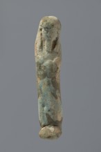Ushabti, Mummy-shaped figurine, very schematically shaped. Hands crossed on the chest. On the head