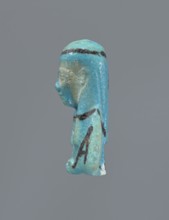 Ushabti, Mummy-shaped figurine, preserved head and fragment of torso. Arms crossed on the chest,