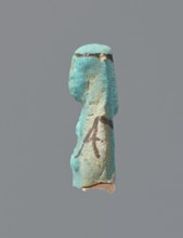 Ushabti, mummy-shaped figurine, preserved head and fragment of torso. Arms crossed on the chest,