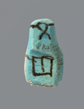 Ushabti, mummy-shaped figurine, preserved head and fragment of torso. Arms crossed on the chest,