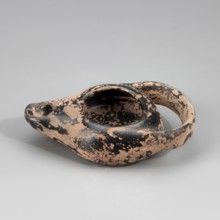 Black-finished lamp, unknown Attic workshop. Lamp made on a wheel. Circular, flattened vessel with