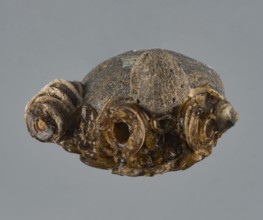 Apotropaic pendant in the shape of a male head; bearded head pendant; pendant in the form of a