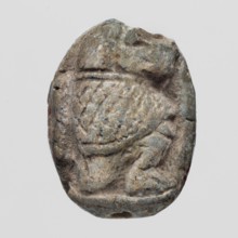 Scaraboid with a monkey. The upper surface of the scaraboid is decorated with a convex image of a