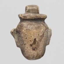Amulet - heart ib; Amulet ib in the shape of a heart with a pendant at the top; maker, materials