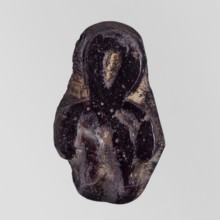 Amulet - tit;, protective amulet in the form of a tit knot with hieroglyphs; Ptolemaic Period,